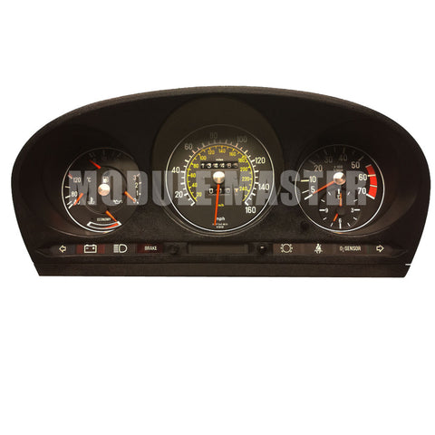 Mercedes 300SD Instrument Cluster with three gauges, an analog odometer, and various lights at the bottom of the cluster.